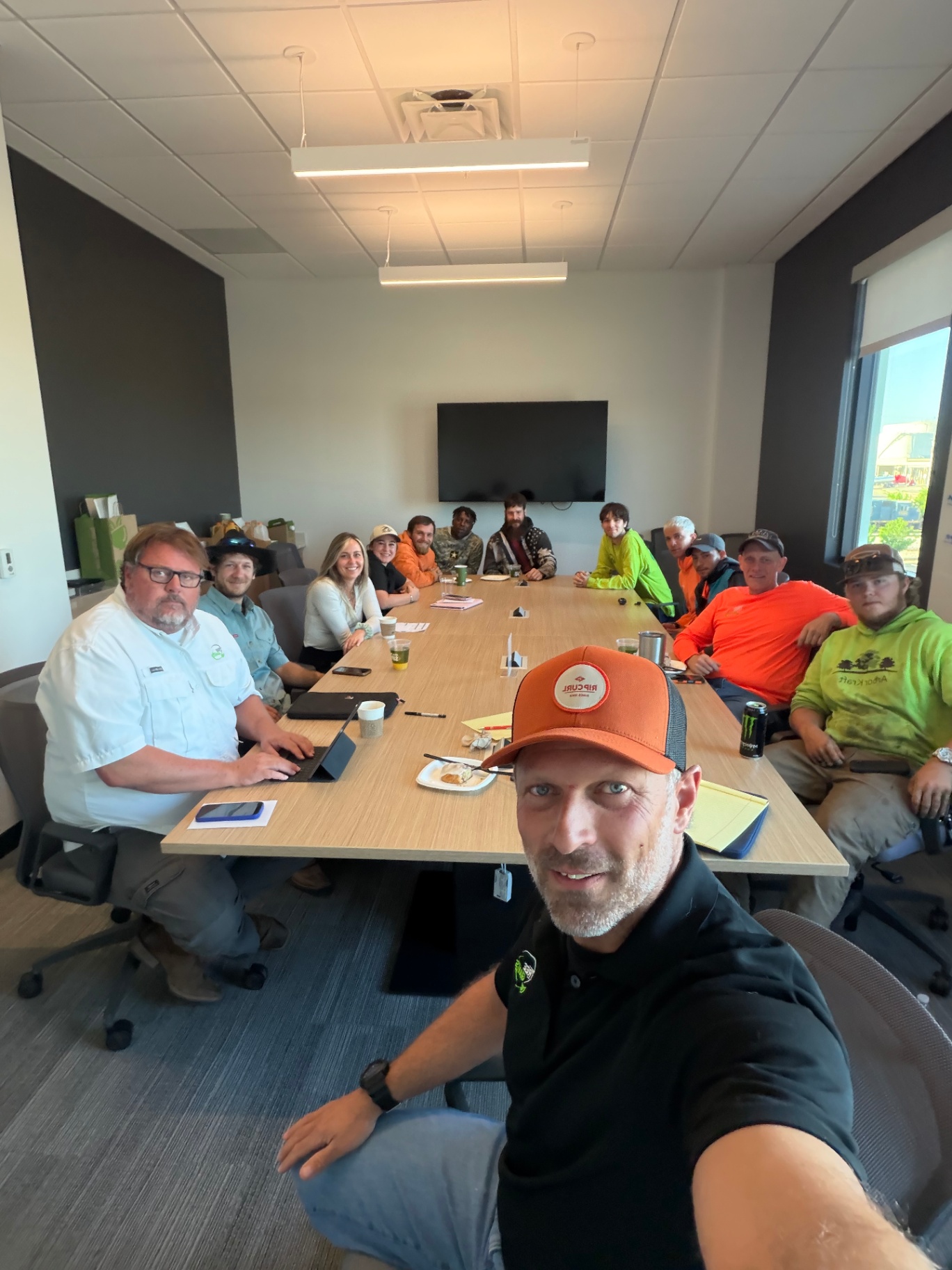 Tree Giants team gathered around a conference table for a planning meeting